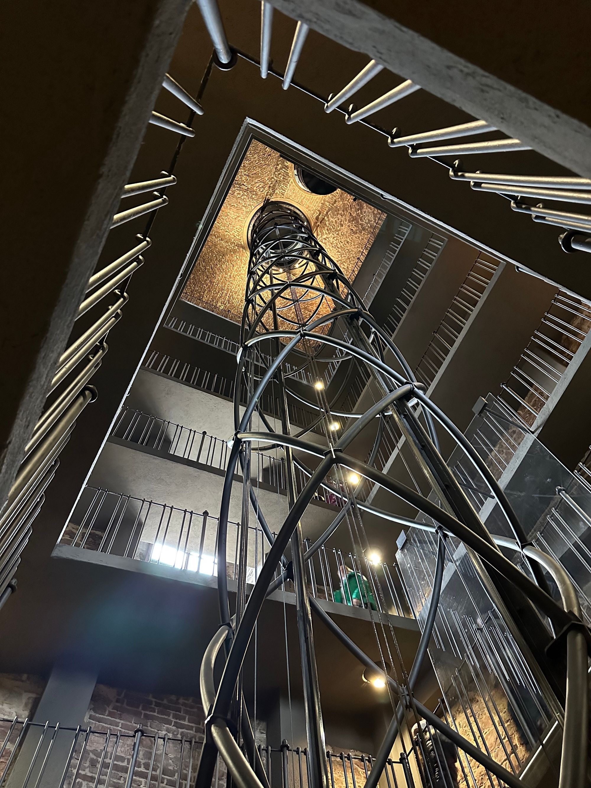 image of inside the Astronomical Clock Tower, looking up from the ground floor